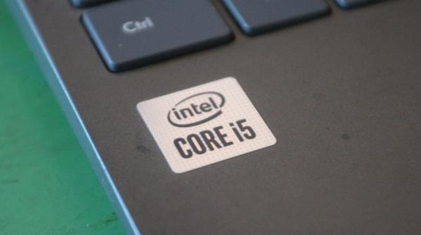 A laptop with an Intel Core i5 sticker near the keyboard