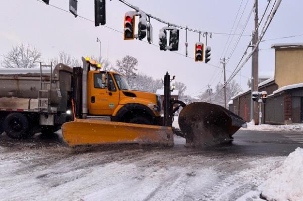 Snow is cleared from the streets in Lowville, N.Y., on Saturday, Nov. 30, 2024. (AP Photo/Cara Anna)