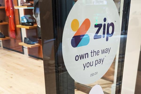 Zip signage is seen on a storefront in Sydney