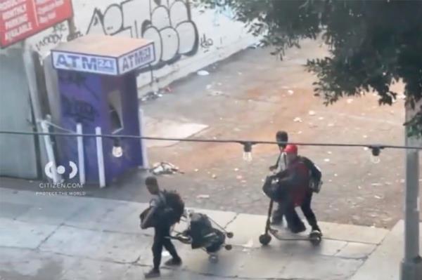 People walking with bags and scooters near morrison hotel