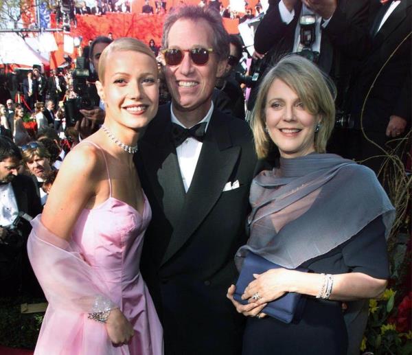 This 21 March 1999 file photo shows US actress Gwyneth Paltrow (L) posing with her father director Bruce Paltrow (C) and mother actress Blythe Danner (R) upon their arrival at the Dorothy Chandler Pavilion in Los Angeles, CA for the 71st Annual Academy Awards.