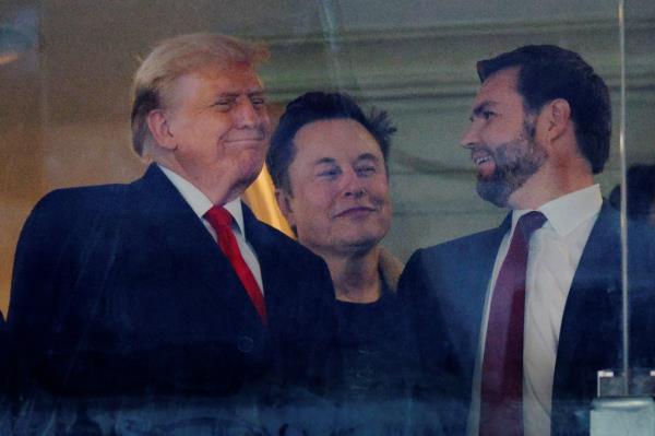 President-elect Do<em></em>nald Trump speaking with Elon Musk and Vice President-elect JD Vance at the Army-Navy football game.