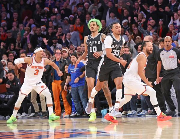 Knicks guard Josh Hart #3, and Jalen Brunson #11, react as time expired as the Knicks beat the Spurs 117-114.