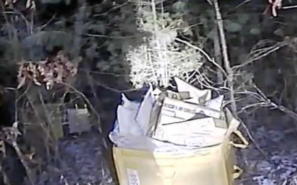 The packages were found in their totes discarded in the woods off the side a Lakeville road