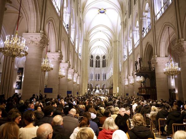 People sitting inside a cathedral.