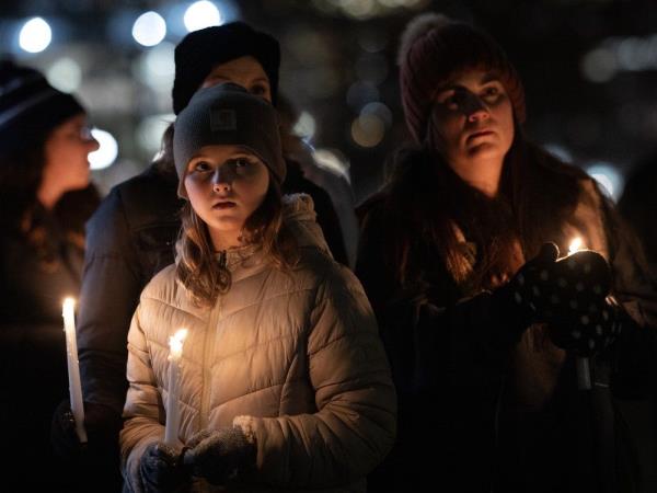 People attend a vigil