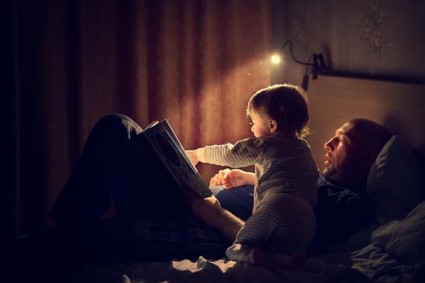 Father and child reading bedtime story